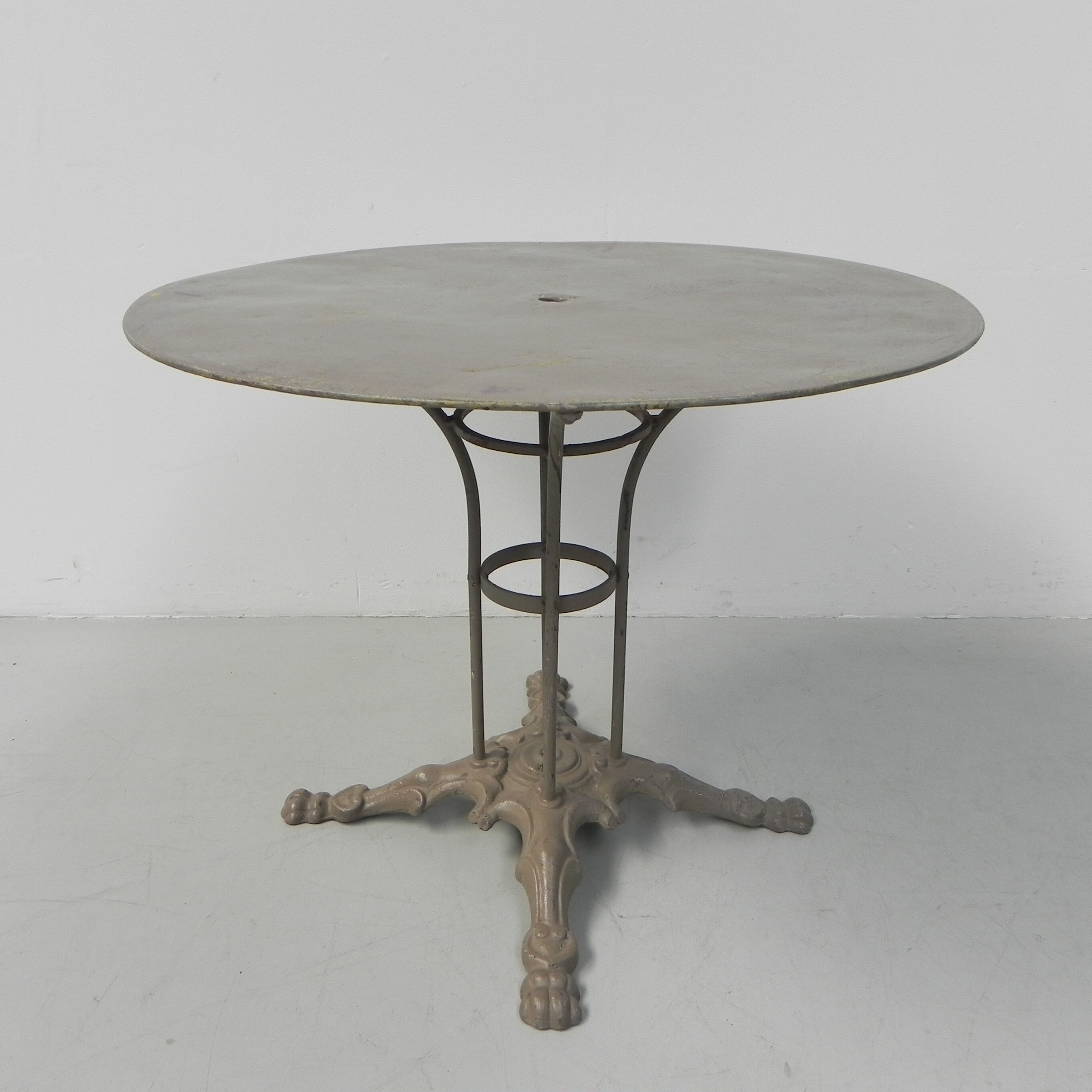 Steel garden table on cast iron base