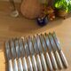 12 large Christofle Ribbons silver metal knives