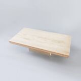 A vintage travertine coffee table