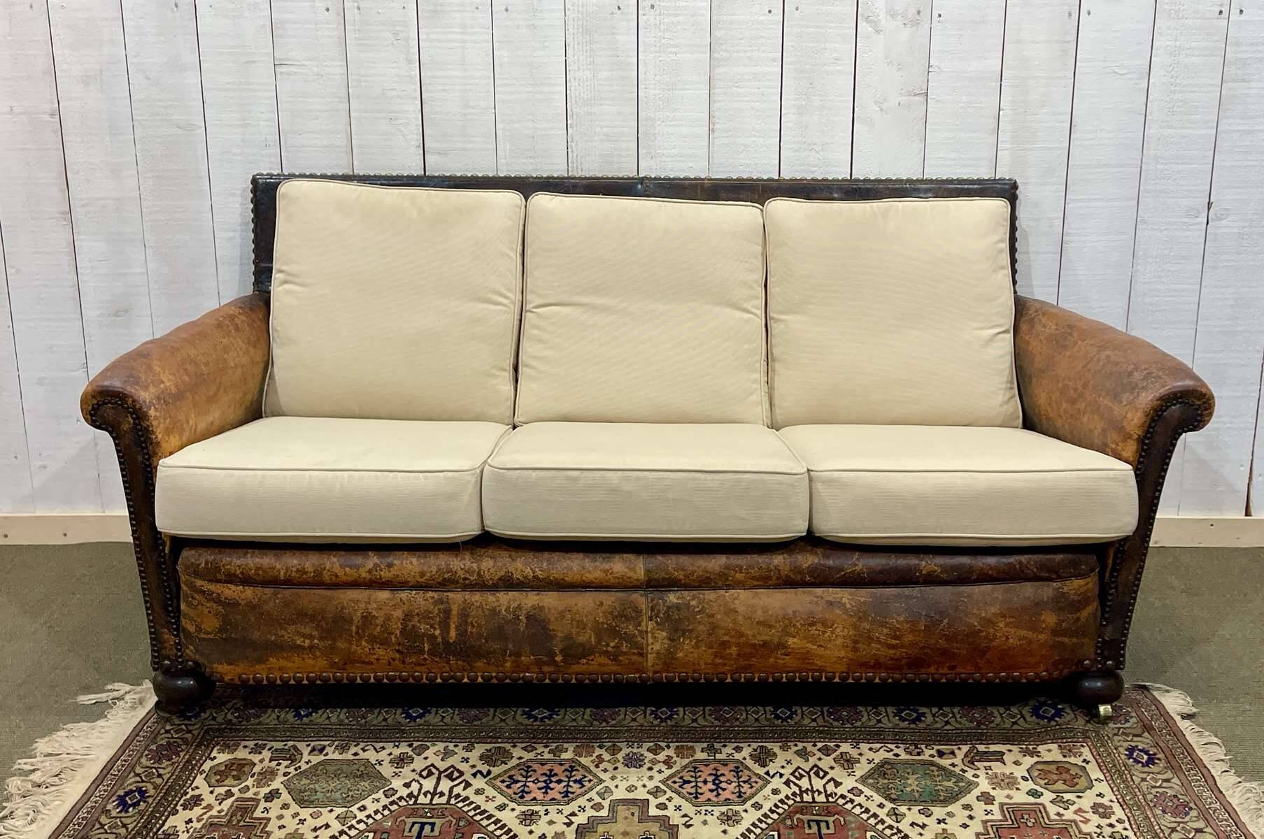 Early 20th century leather club sofa - seat and back in modern fabric