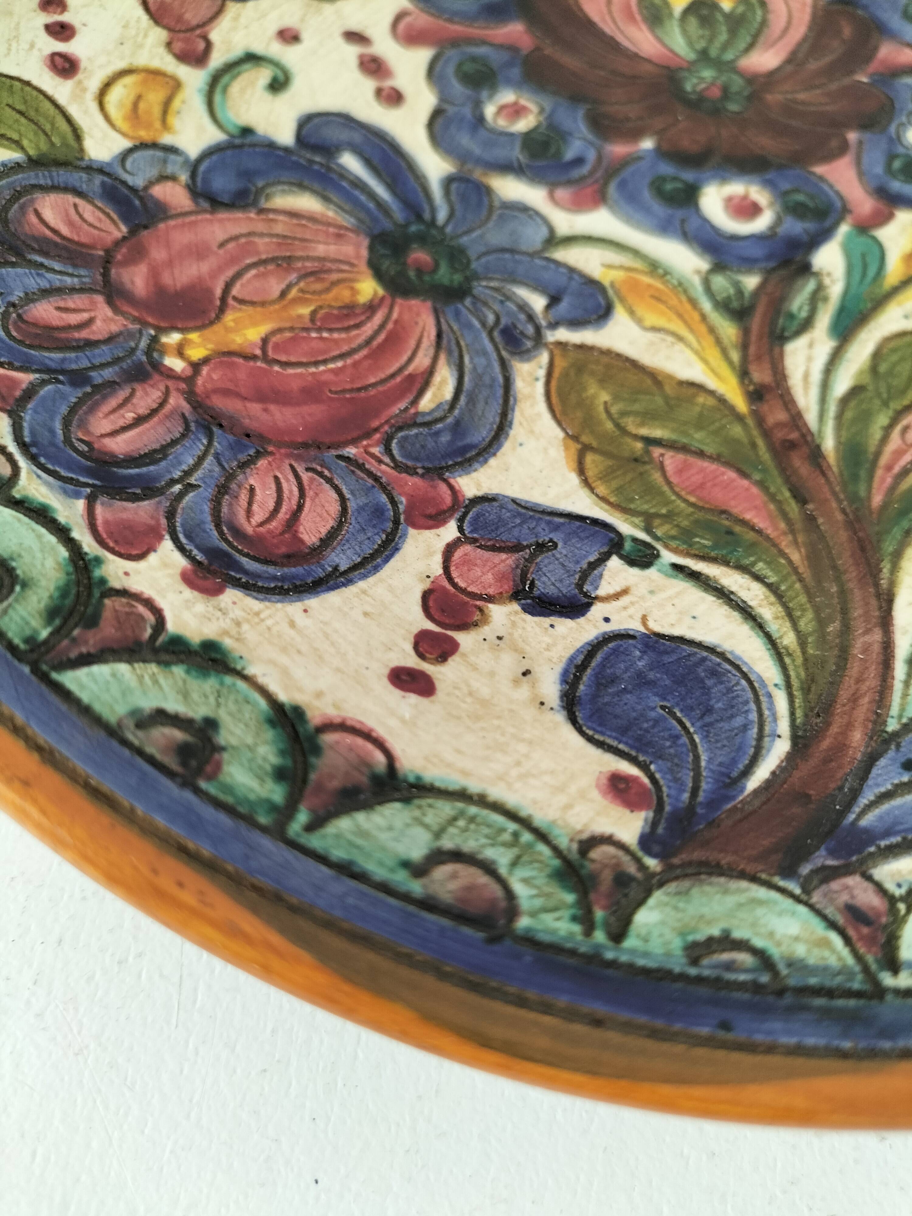 Spanish earthenware plate, hand-painted floral decoration.
