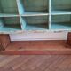 Old library shelf in patinated grocery tree
