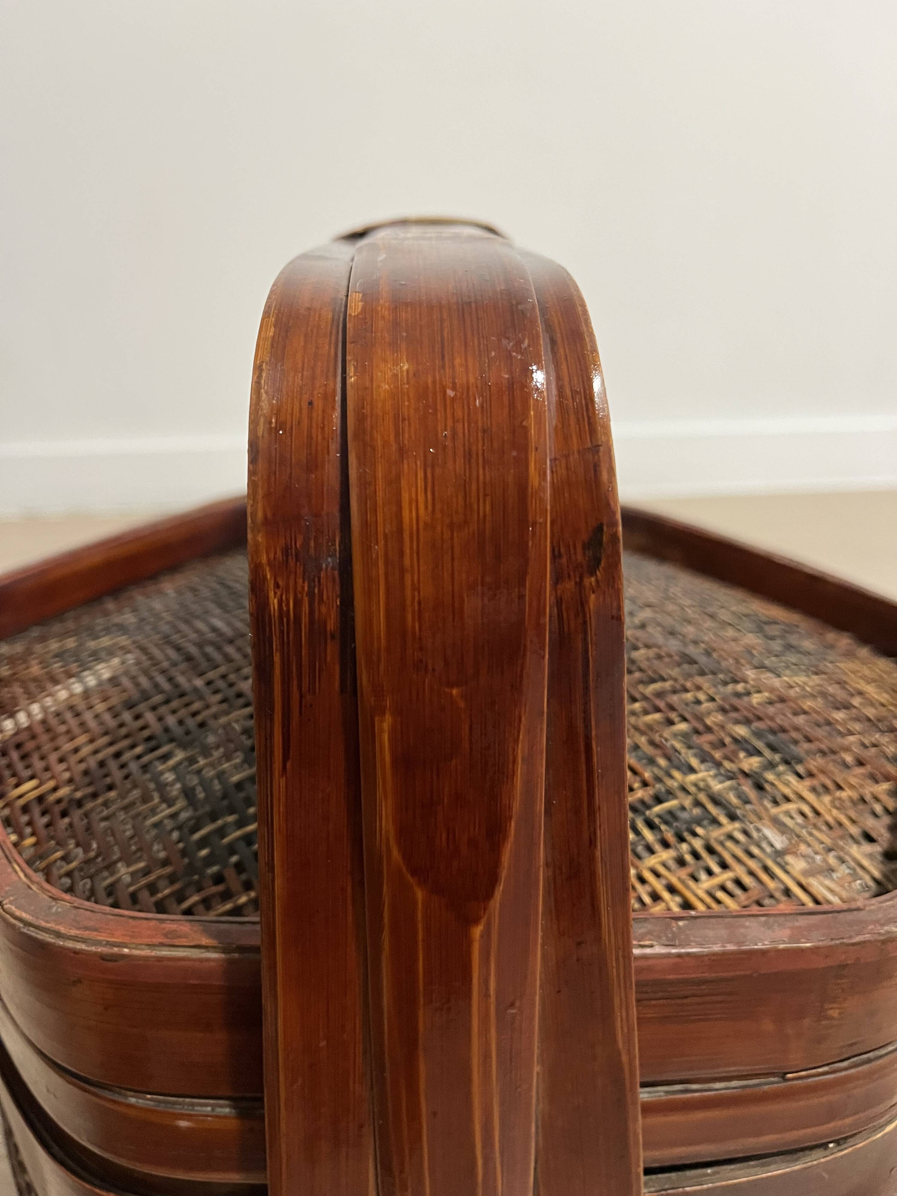 Ancient wooden and woven wicker basket,