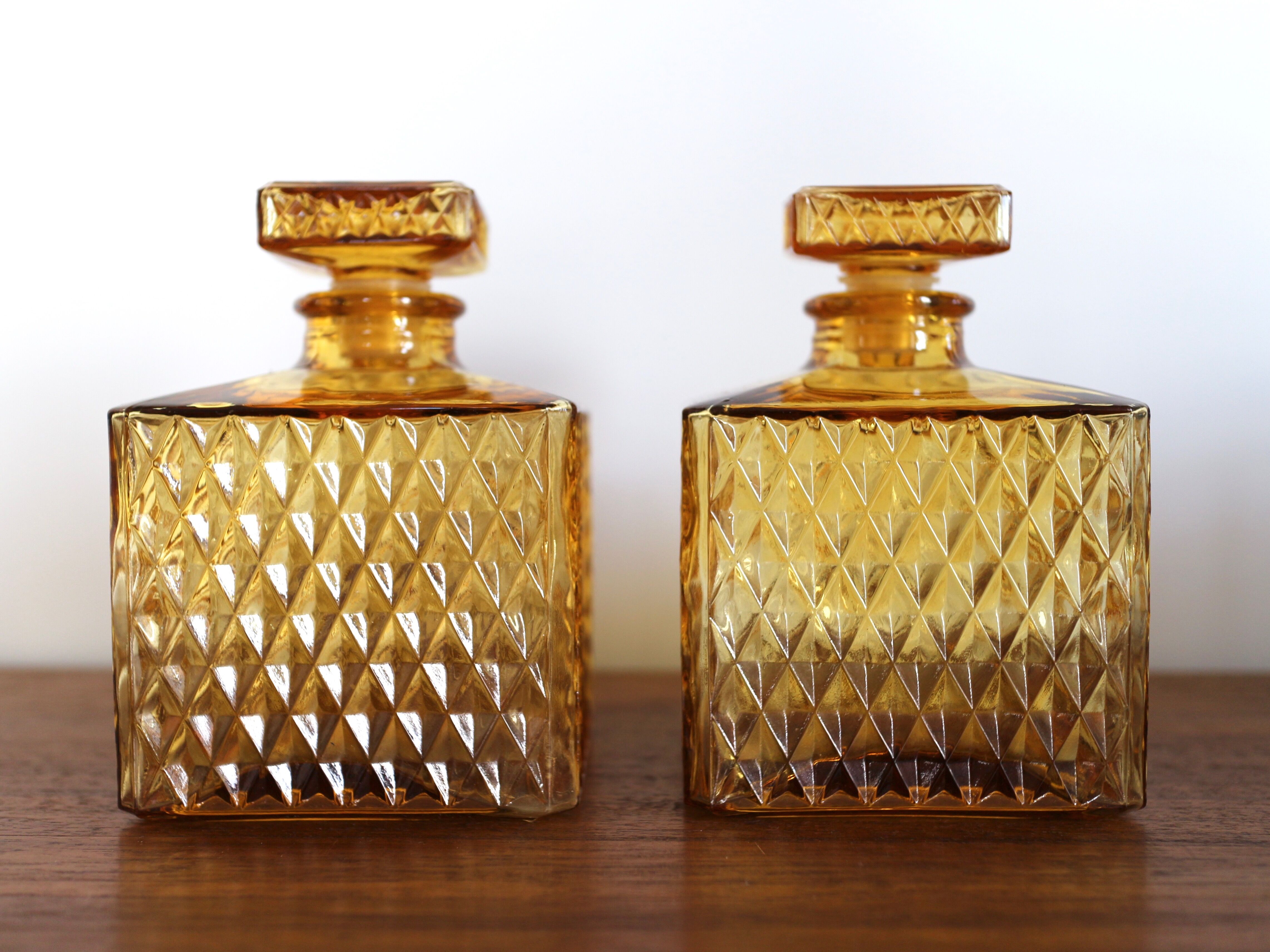 2 yellow glass whiskey carafes