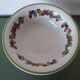 Large ceramic fruit bowl with red fruits