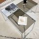 Set of 2 vintage nesting coffee tables in chrome metal and smoked glass.