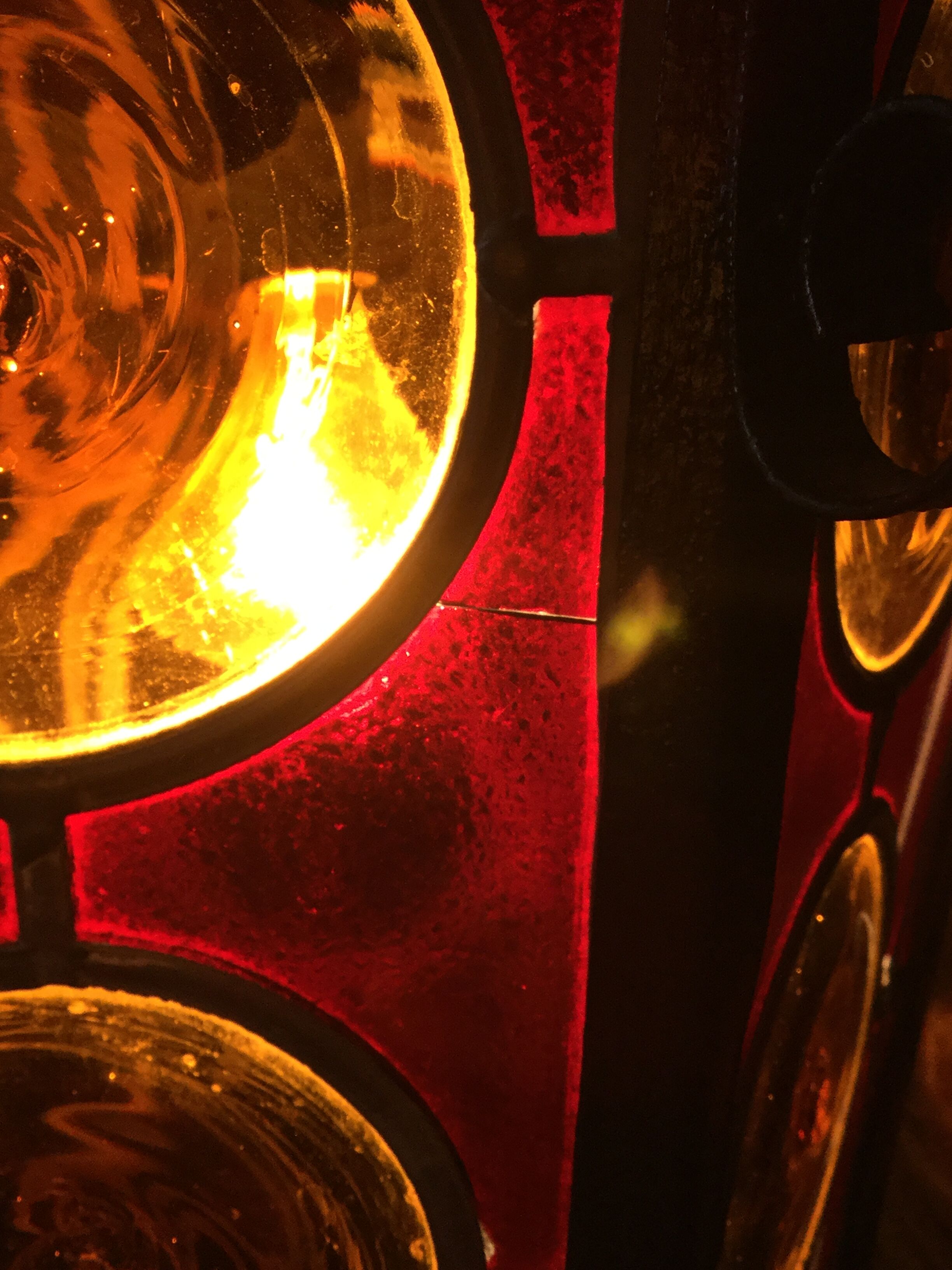 Wrought iron lantern and stained glass windows