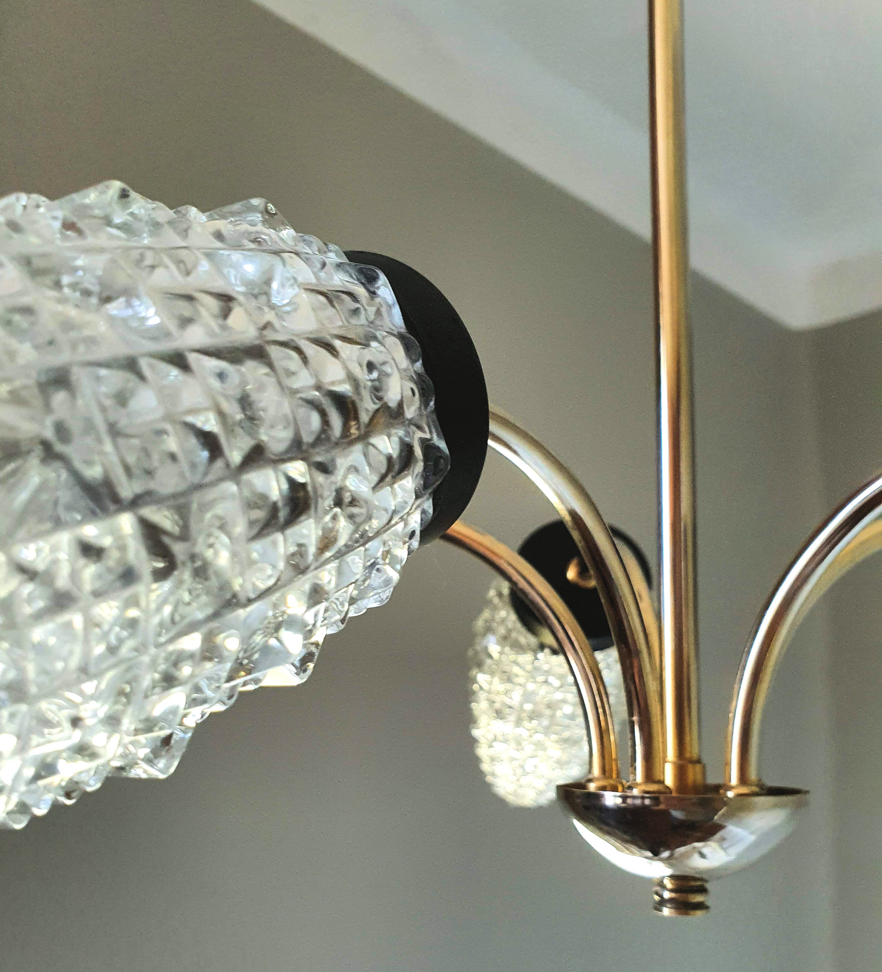 Vintage chandelier in brass and glass