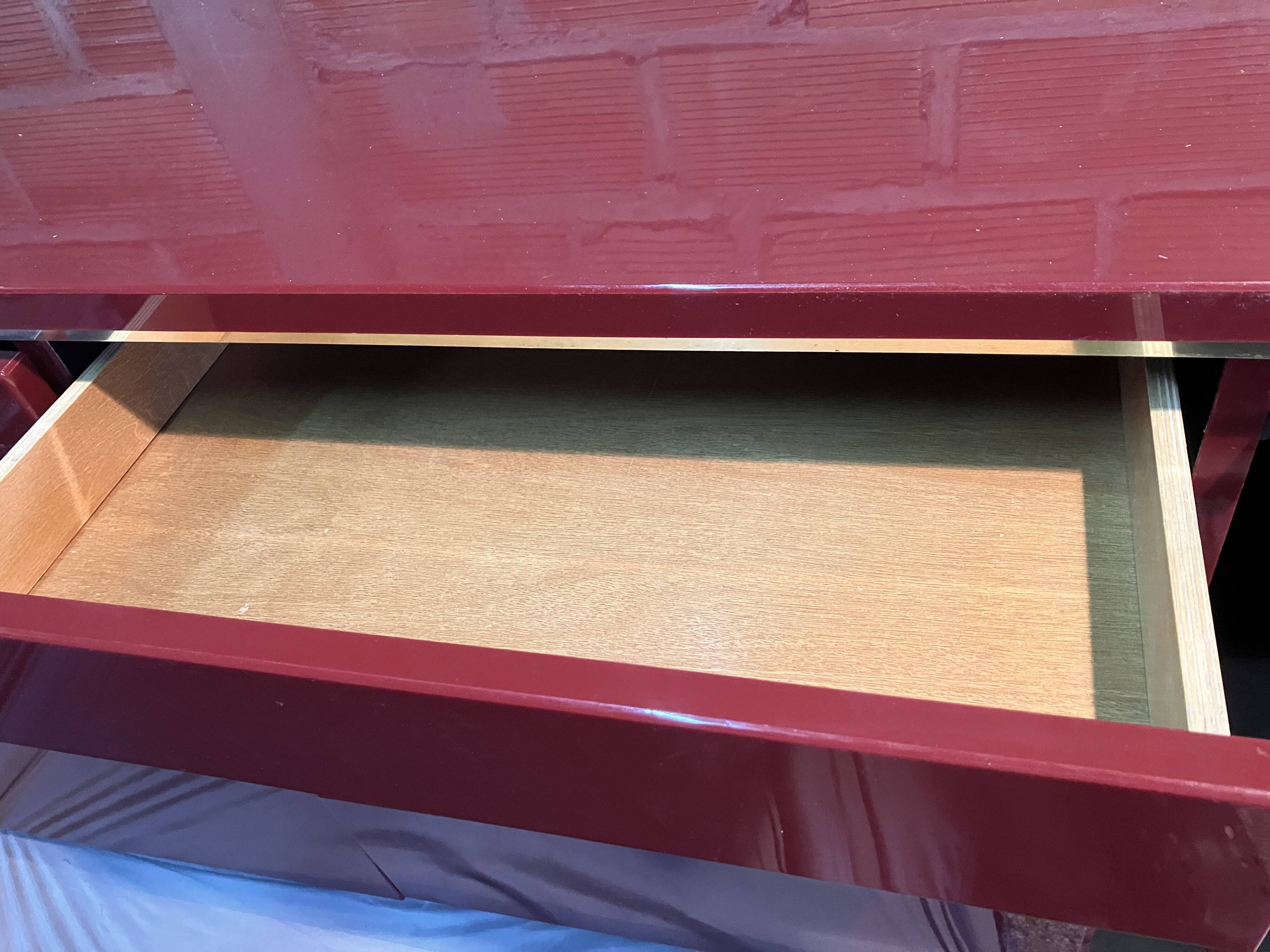 Burgundy lacquered vintage enfilade and brass by Eric Maville