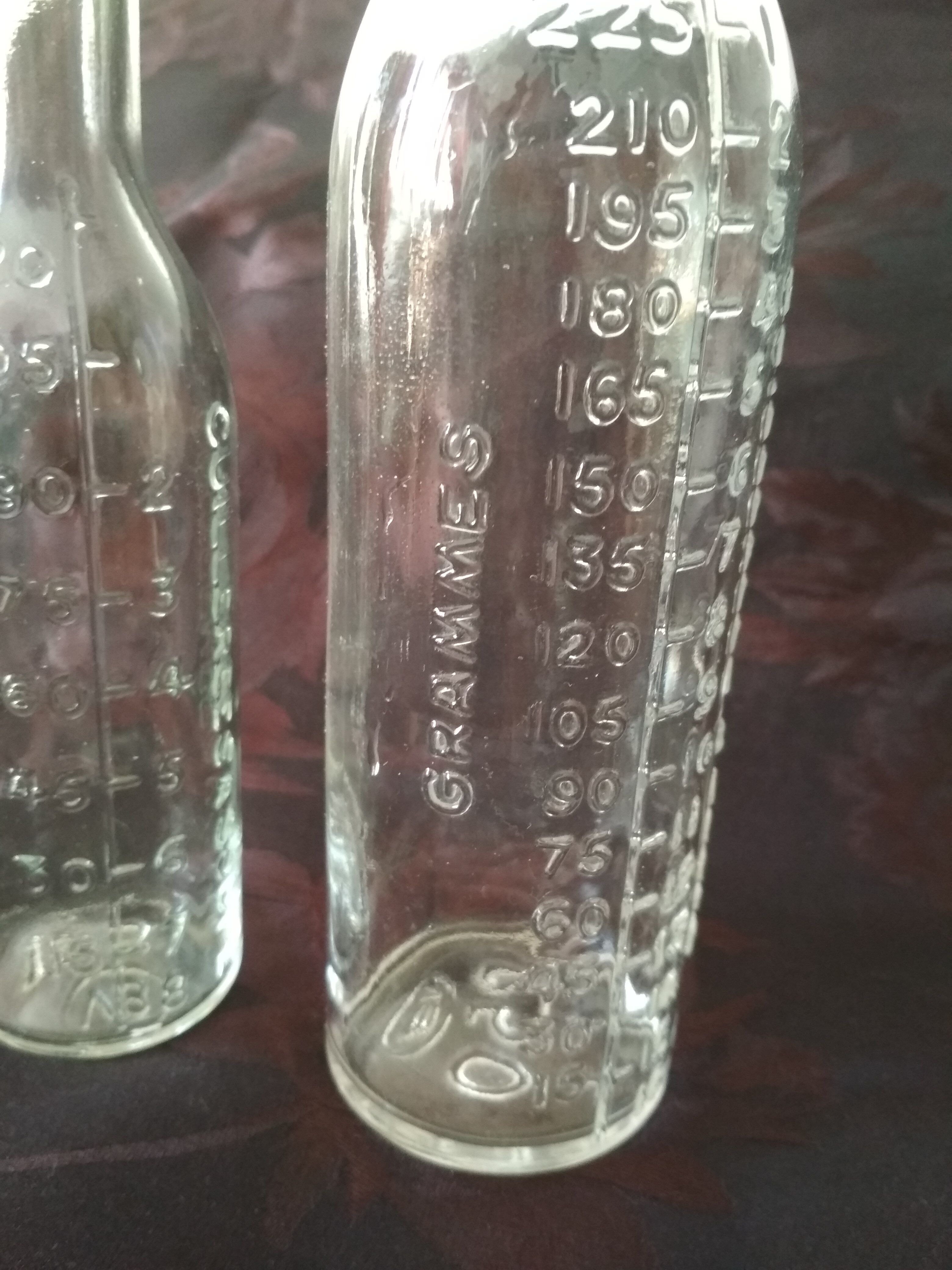 2 old graduated pharmacy bottles
