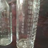 2 old graduated pharmacy bottles