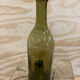 Bouteille en verre verte ancienne Wabi Sabi