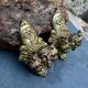 Pair of bronze wall sconces with mask, signed L. Pinet, Art Nouveau period.