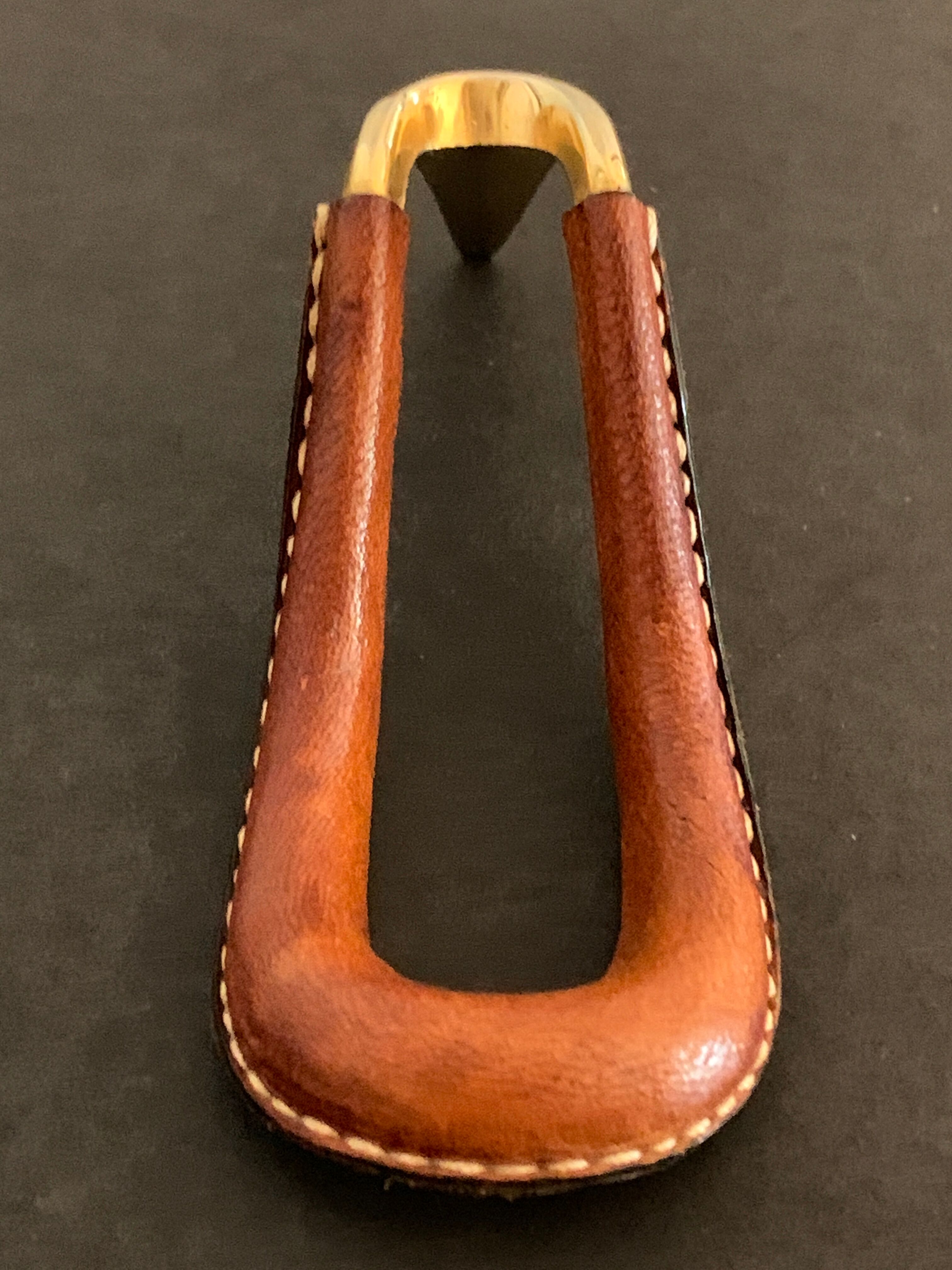 Carl Auböck pipe rack in leather and bronze, 1963