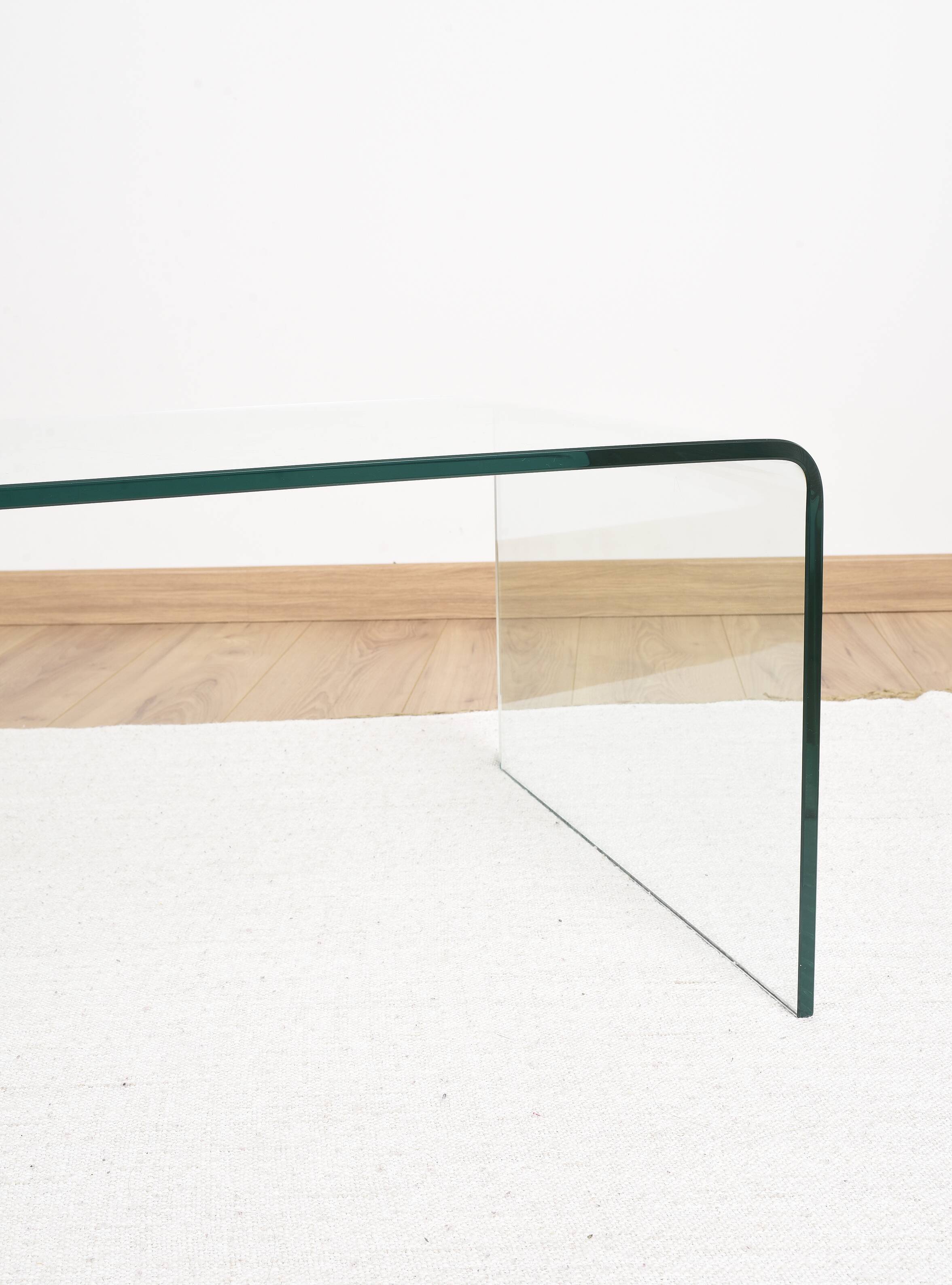 Transparent tempered glass coffee table.