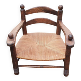 Low straw fireplace armchair in Dudouyt style