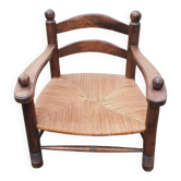 Low straw fireplace armchair in Dudouyt style