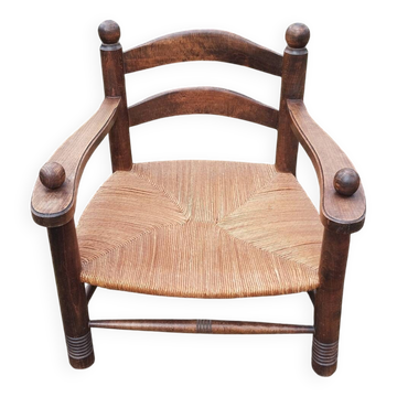 Low straw fireplace armchair in Dudouyt style