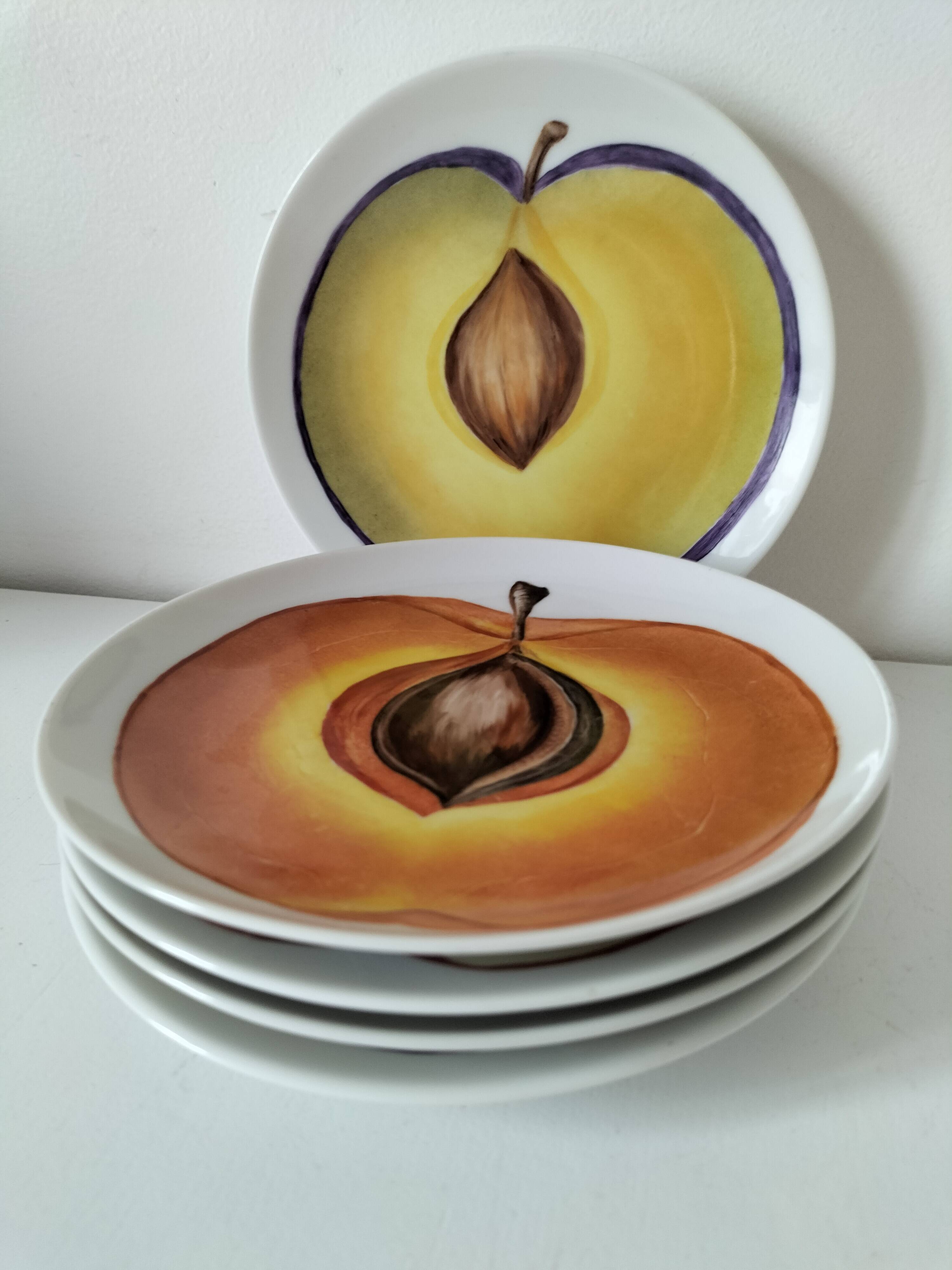 5 hand-painted dessert plates with stylised fruit designs.