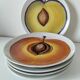 5 hand-painted dessert plates, decorated with stylised fruits.