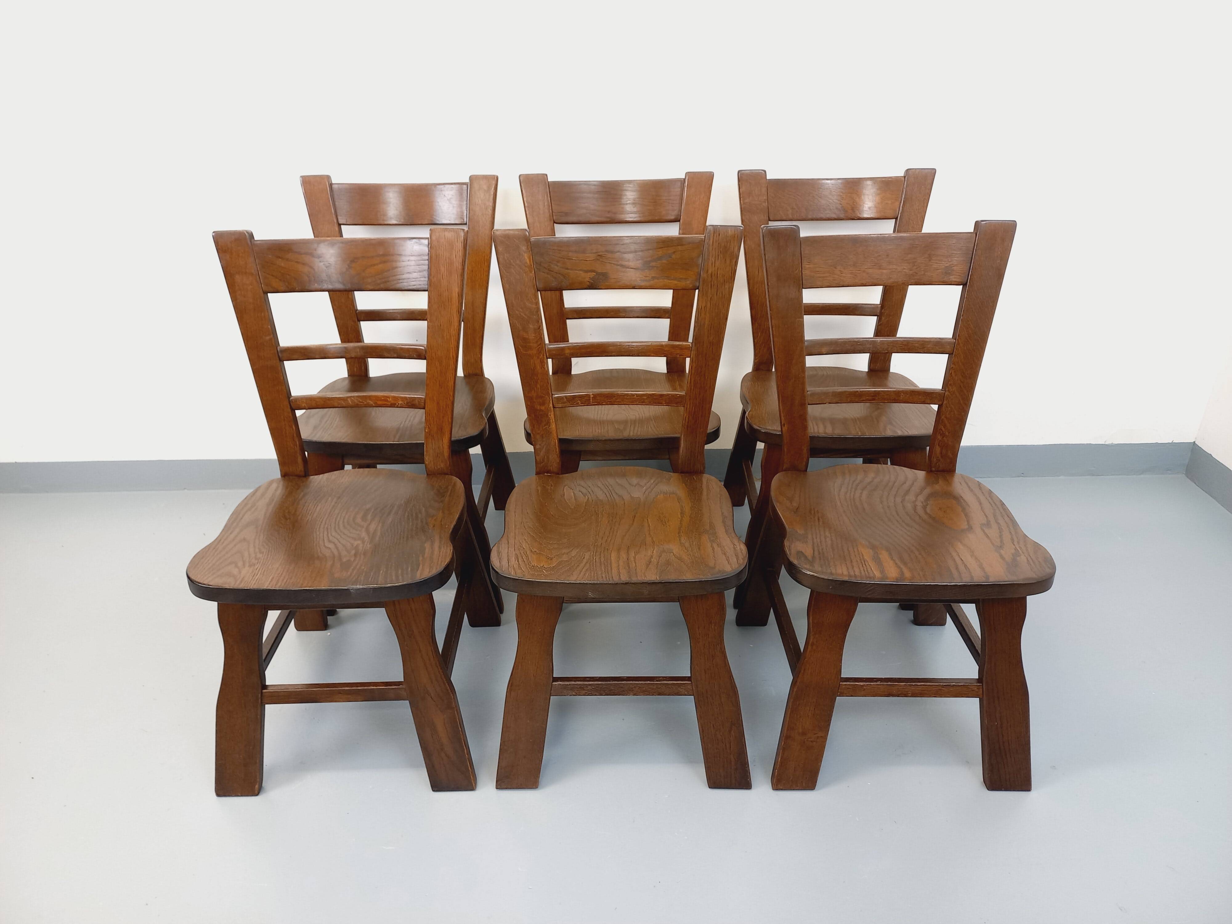 Set of 6 vintage brutalist oak chairs from the 1950s.