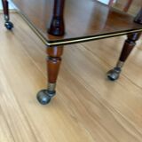 Vintage side table in varnished wood, with casters and gold threads