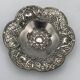 Silver-plated metal pocket emptier with openwork outline decoration