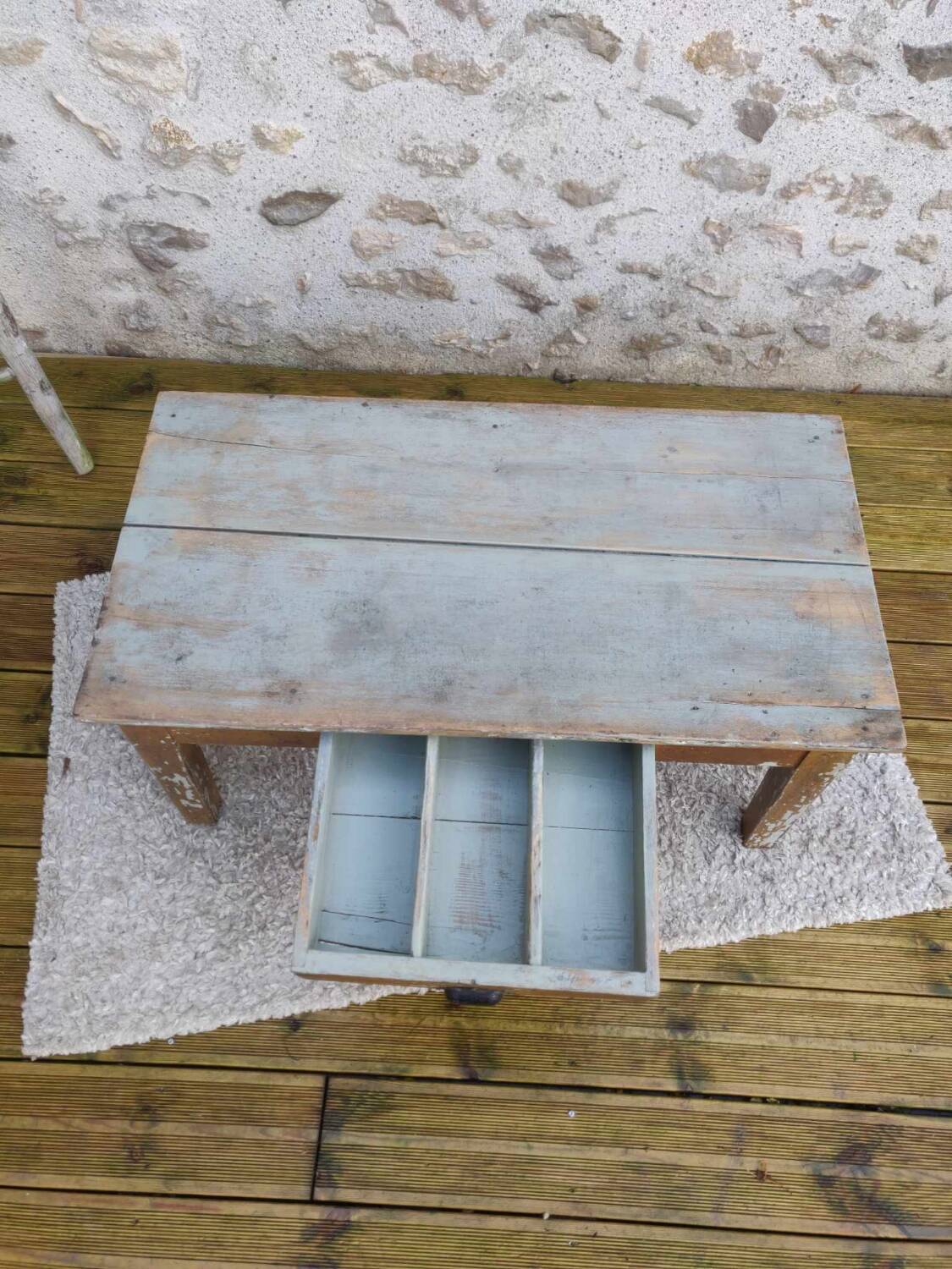 Patinated coffee table with a drawer
