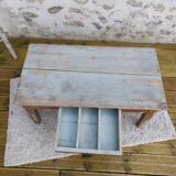 Patinated coffee table with a drawer