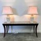 Pair of large cream ceramic table lamps with relief peacocks and fabric shades