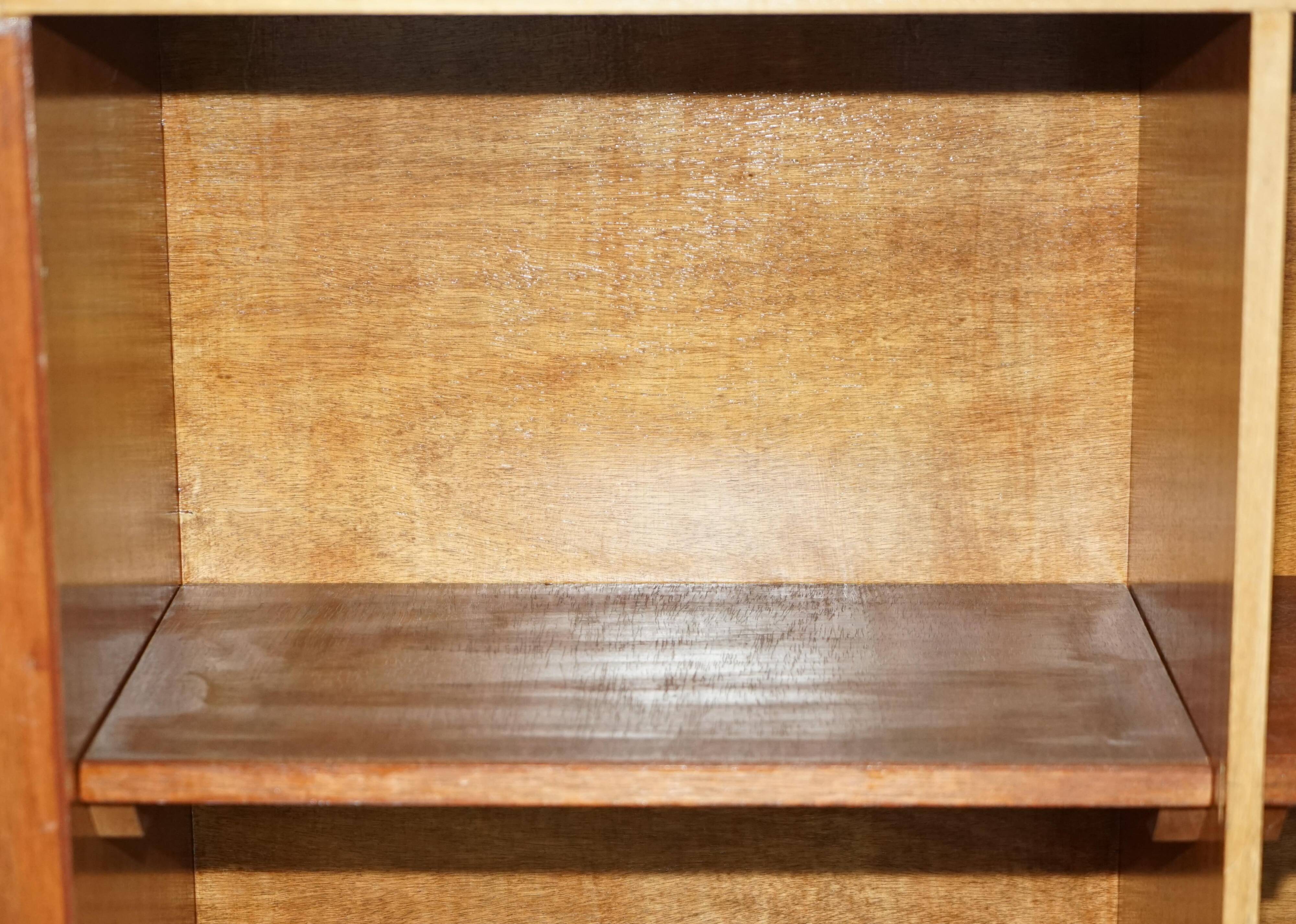 Library in the style of David Linley in satinwood, walnut, and rosewood.