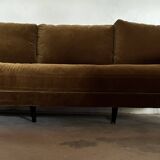 Large velvet three-seater sofa