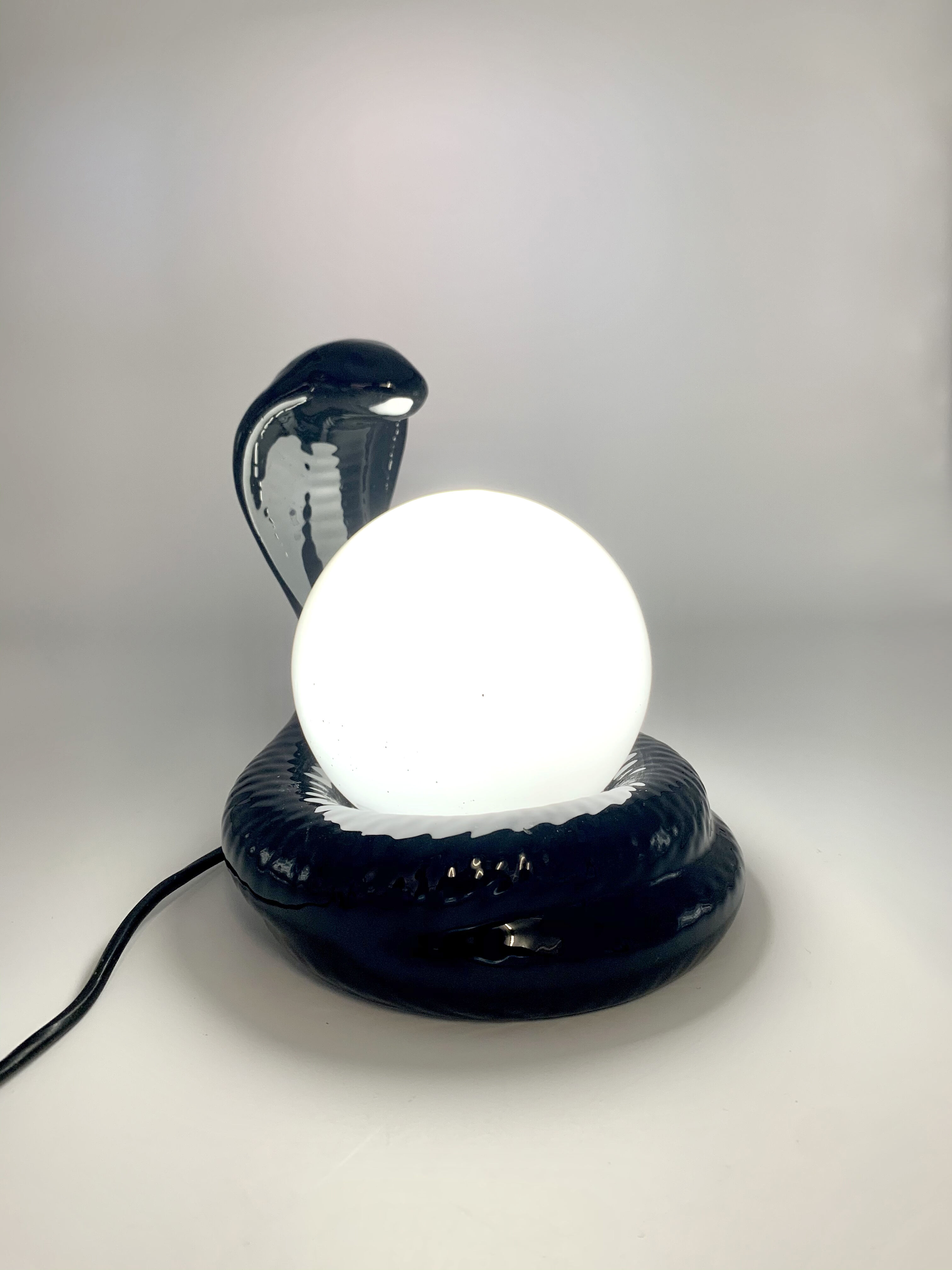 Black ceramic cobra lamp