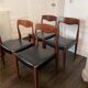 Set of 4 vintage designer chairs in teak and black skai 60's
