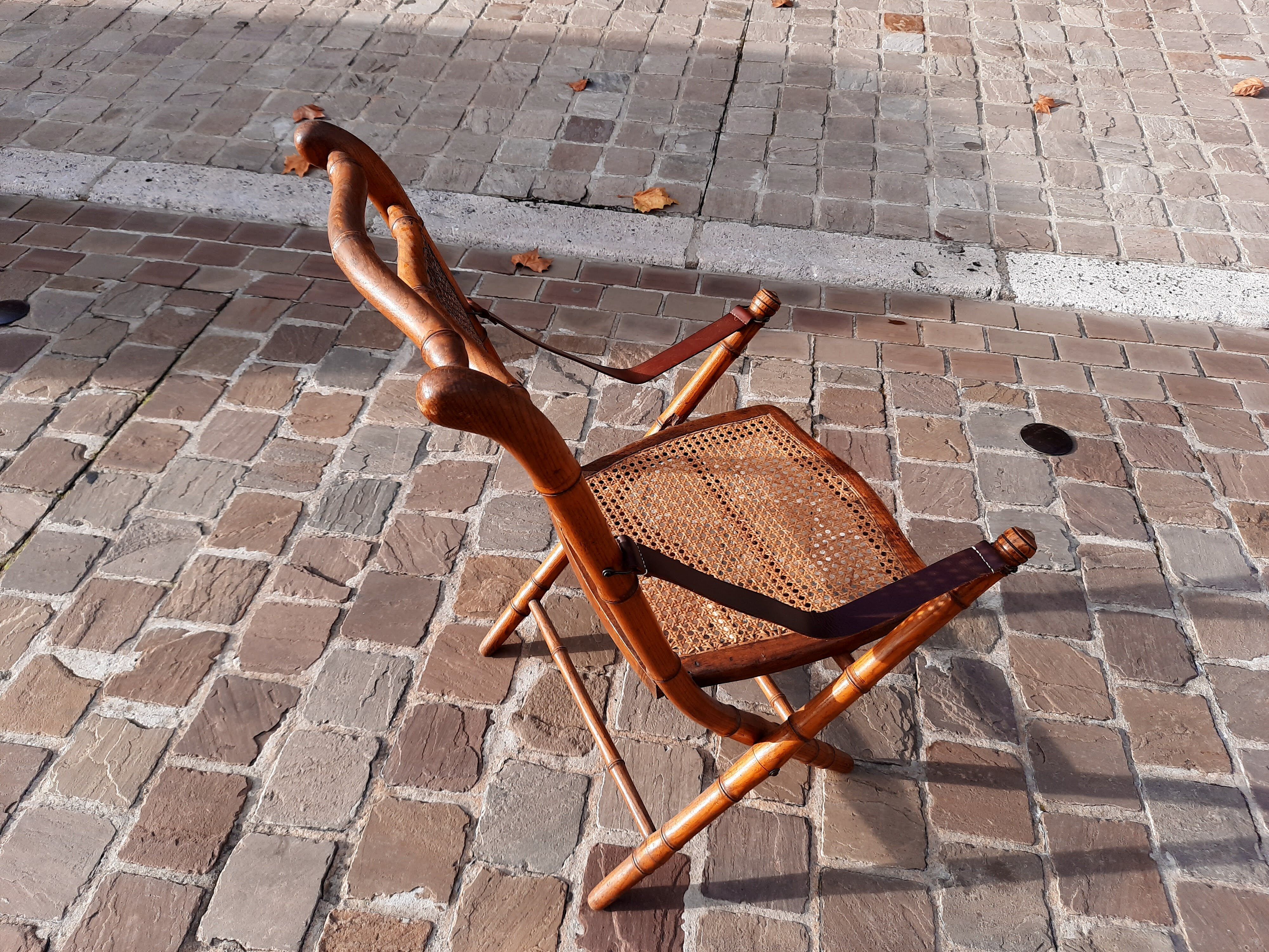 Bamboo folding chair and caning, leather and brass