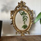 Petit miroir ovale signé Tallandier en laiton doré style Rococo – 30x2