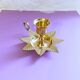 Golden brass hand candle holder decorated with leaves