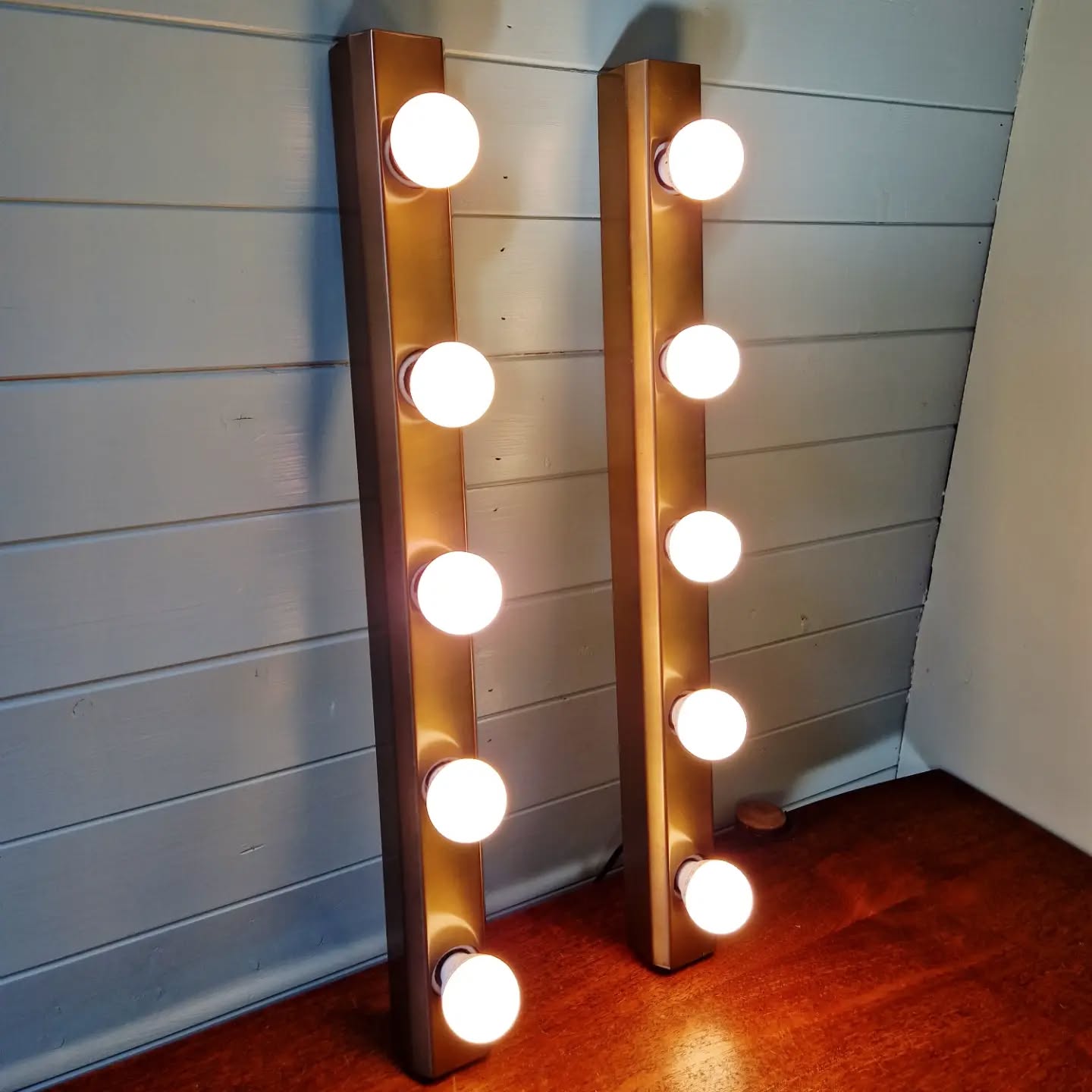 Set of three wall sconces in solid brass, 1970s-80s.