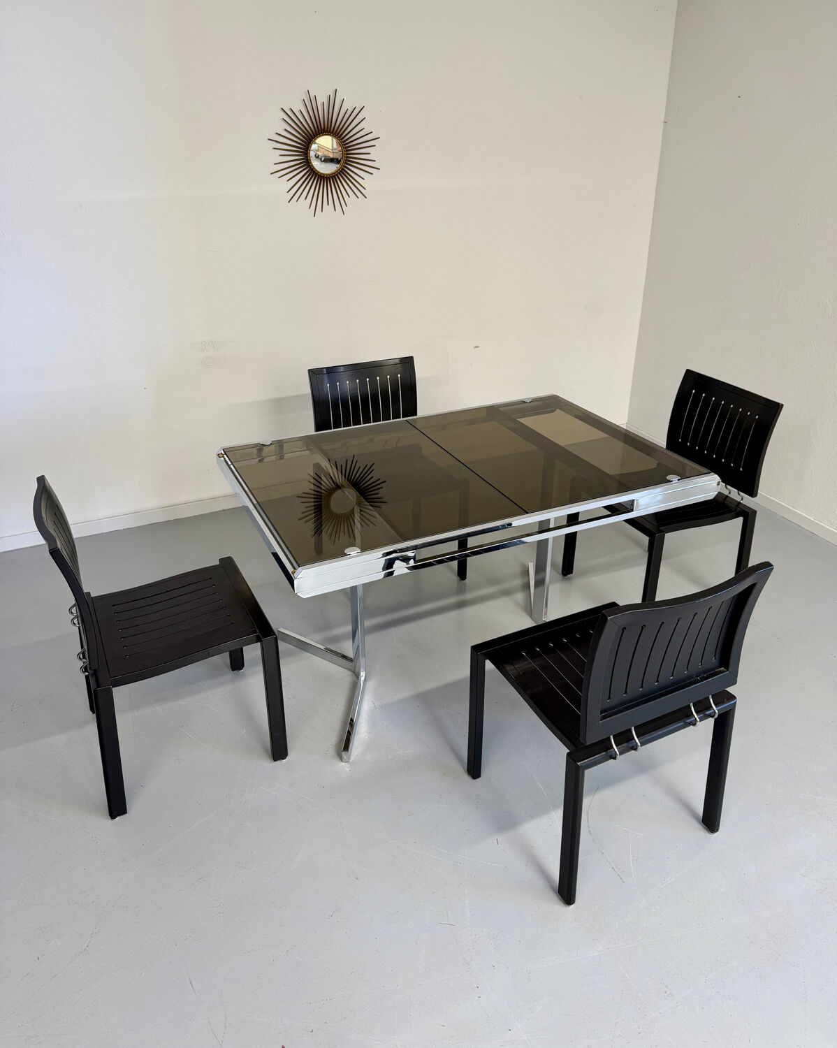 Smoked glass dining table with chrome legs, 1970s design by Roche Bobois.