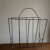 Mid-century poetic magazine rack in black metal