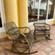 Pair of rocking-chairs in rattan 70s