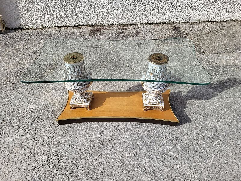 Italian coffee table with glass top, wooden base, and porcelain legs