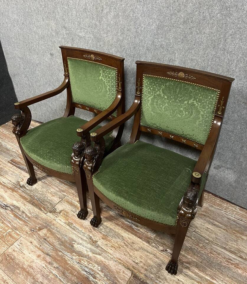 Pair of Empire-Consulate armchairs in molded and carved mahogany
