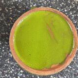 Small two-tone green glazed terracotta jug, height 12 cm.