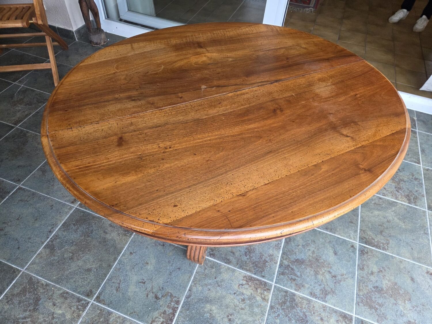 Extendable walnut table in the Napoleon III style.