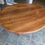 Extendable walnut table in the Napoleon III style.