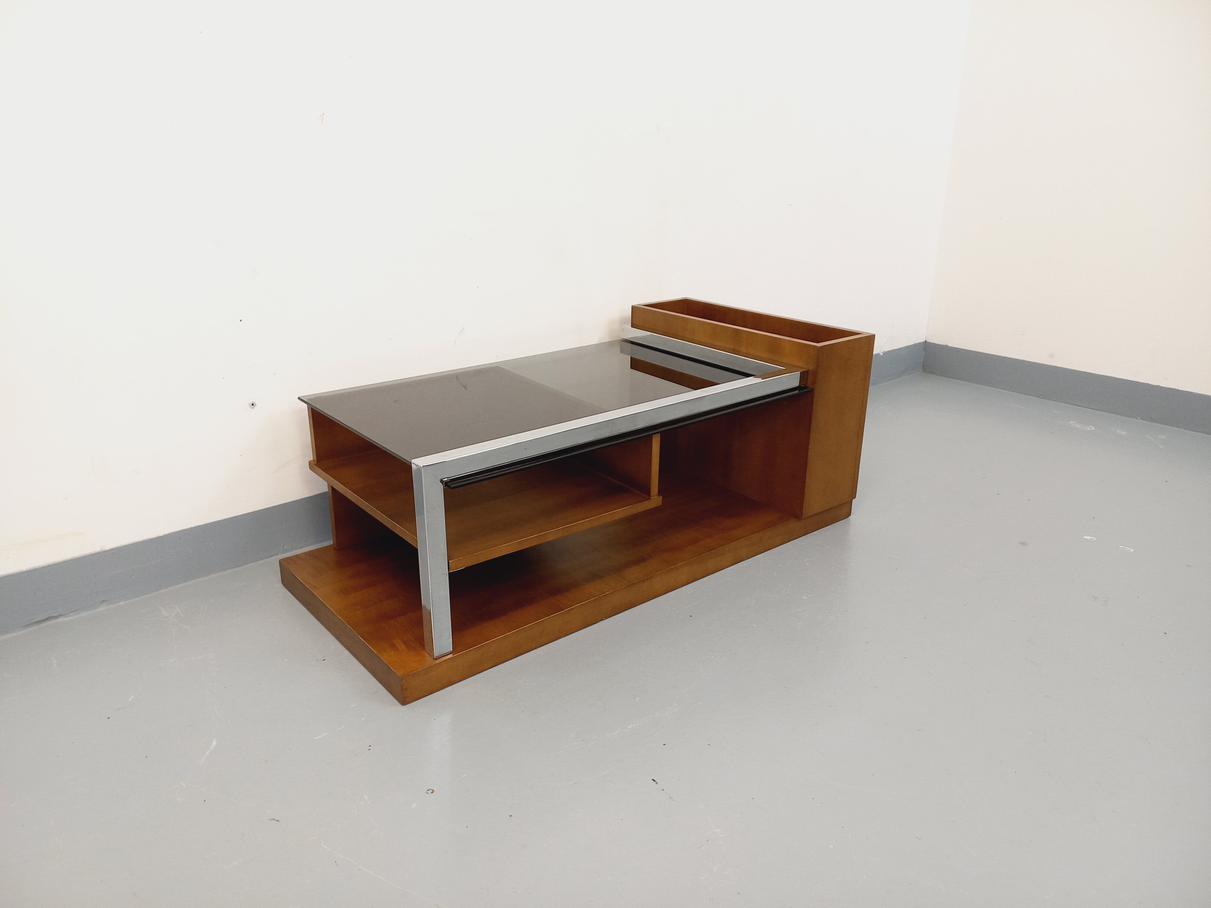 Rectangular vintage modernist coffee table with wooden niches, chrome.