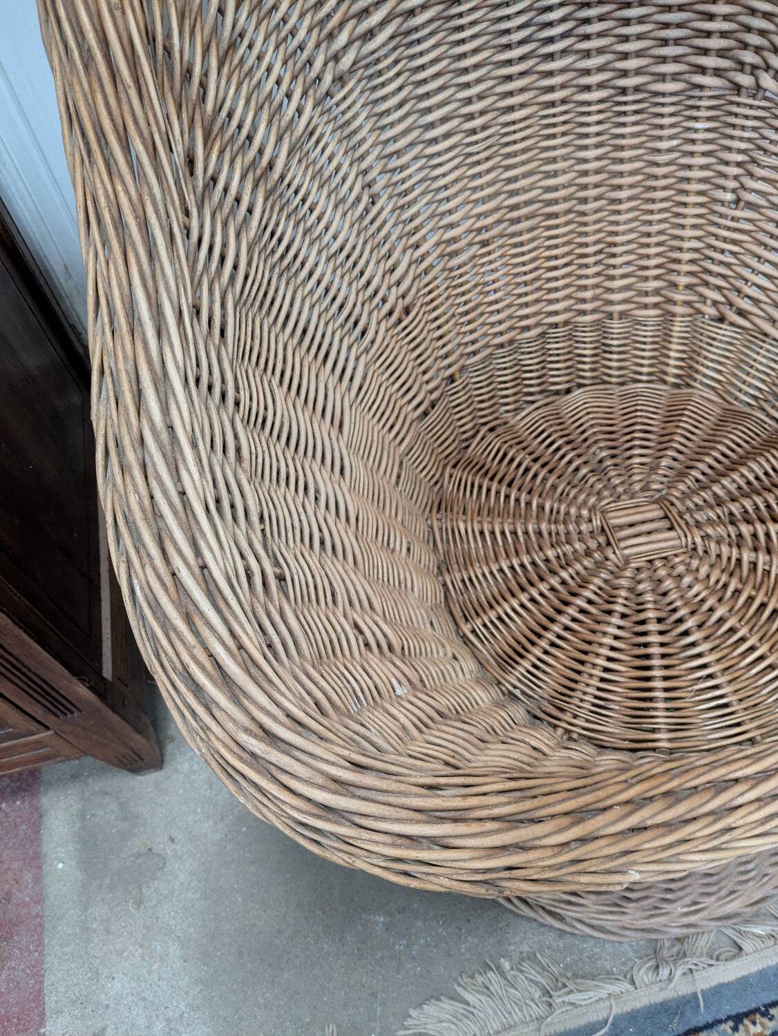 Large woven rattan armchair
