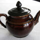 Old brown glazed ceramic coffee pot