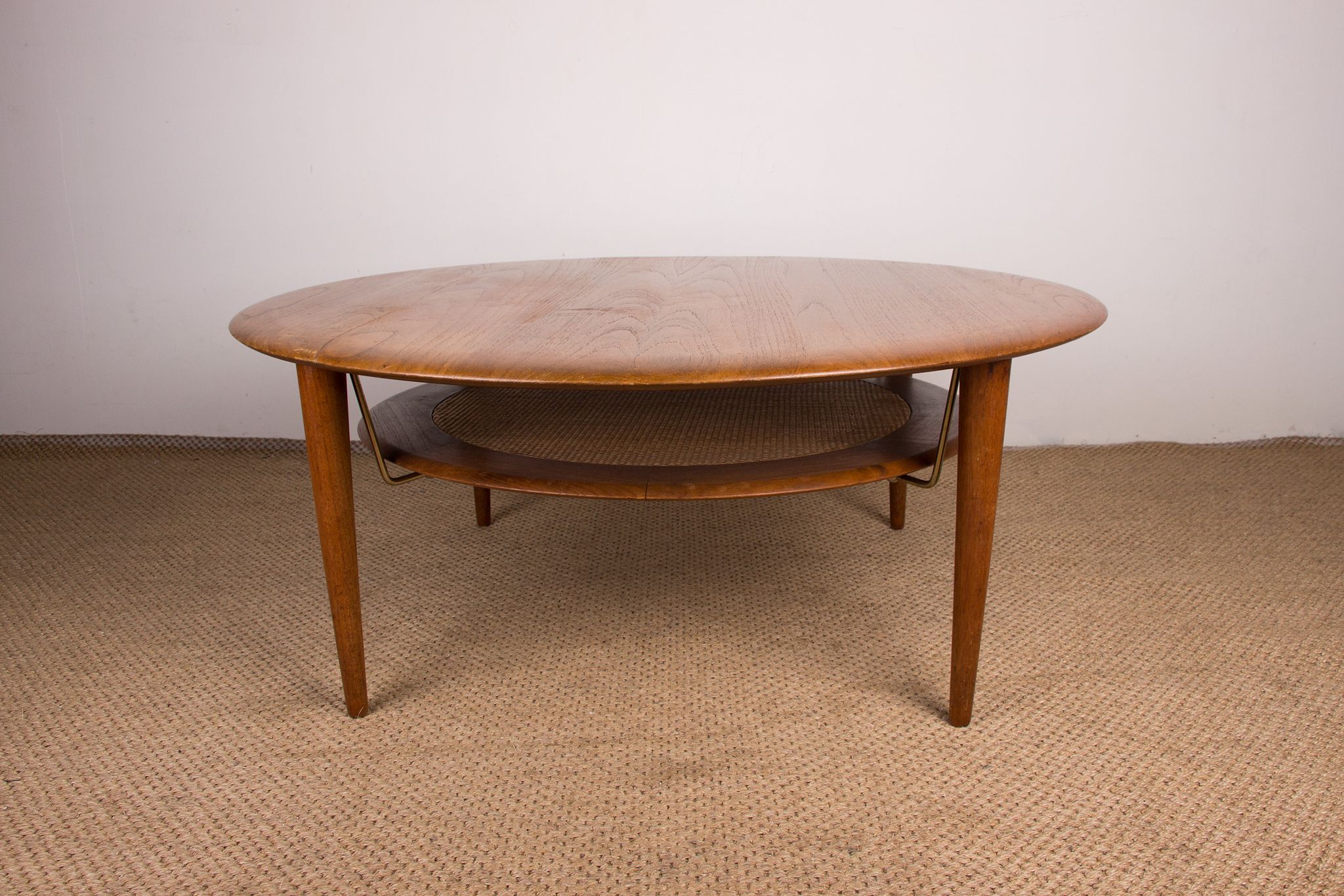 Round coffee table, two levels, danish in teak, brass and cannage
